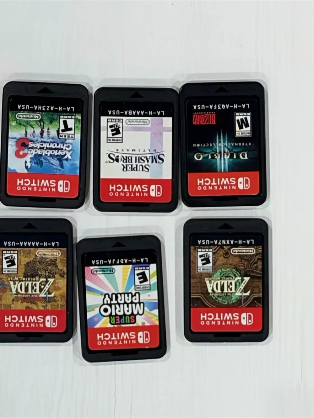 Nintendo Switch Bundle – 6 Top Games, Extra Joy-Cons, Case Price: $350